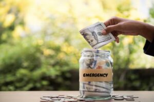 Jar labeled emergency fund representing financial safety