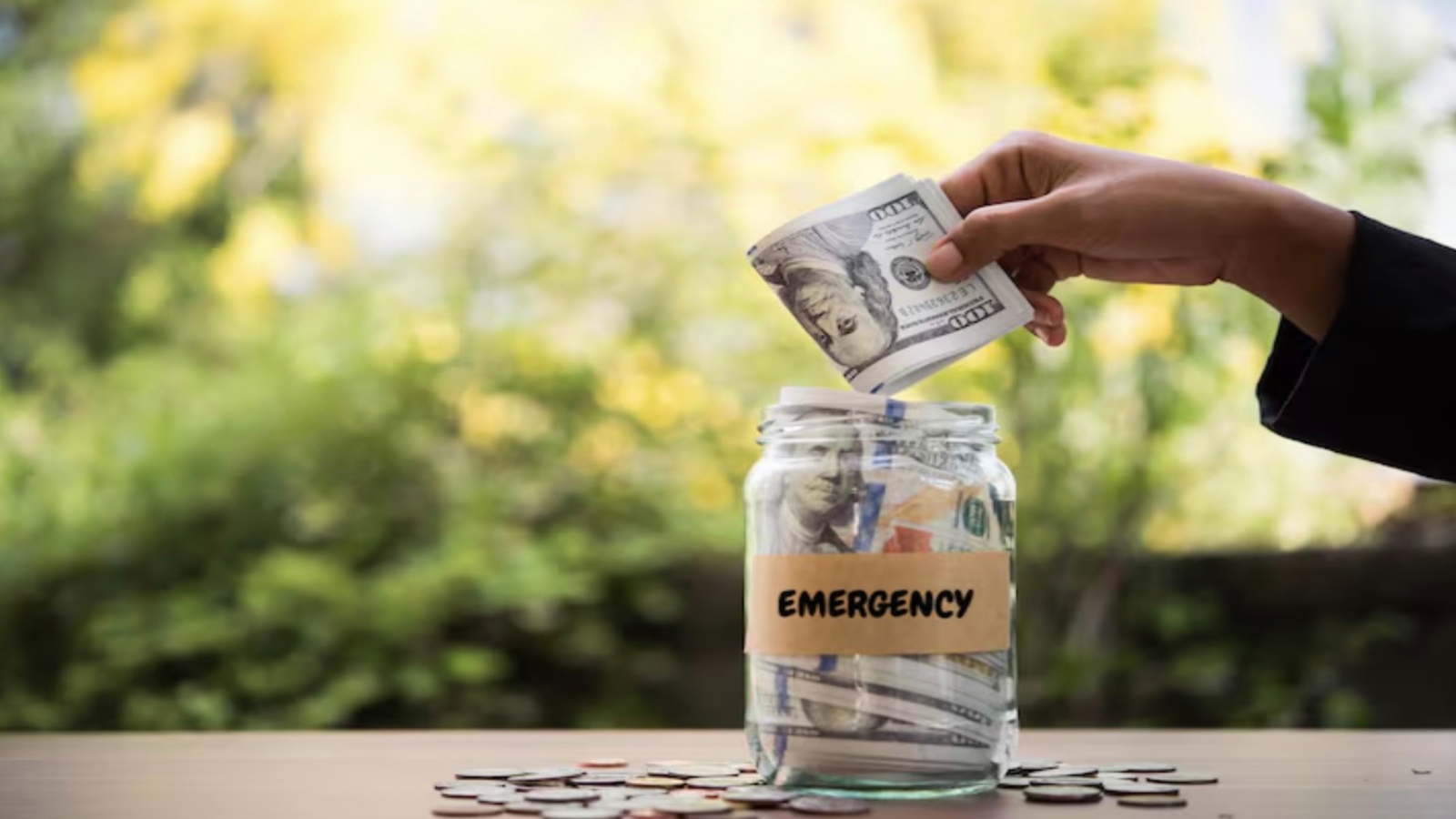 Jar labeled emergency fund representing financial safety