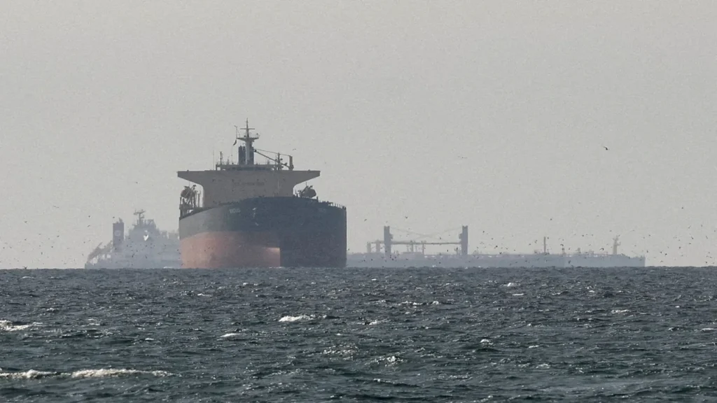 Oil tankers traveling through the Strait of Hormuz as global energy markets react to Middle East conflict 