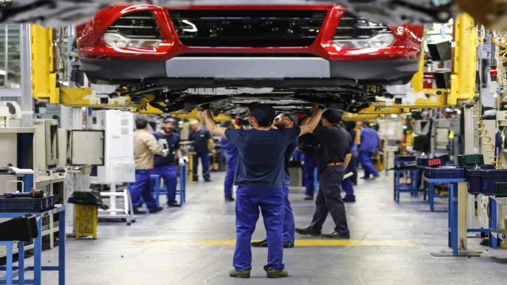 Vehicle assembly line inside a European automotive factory highlighting production operations