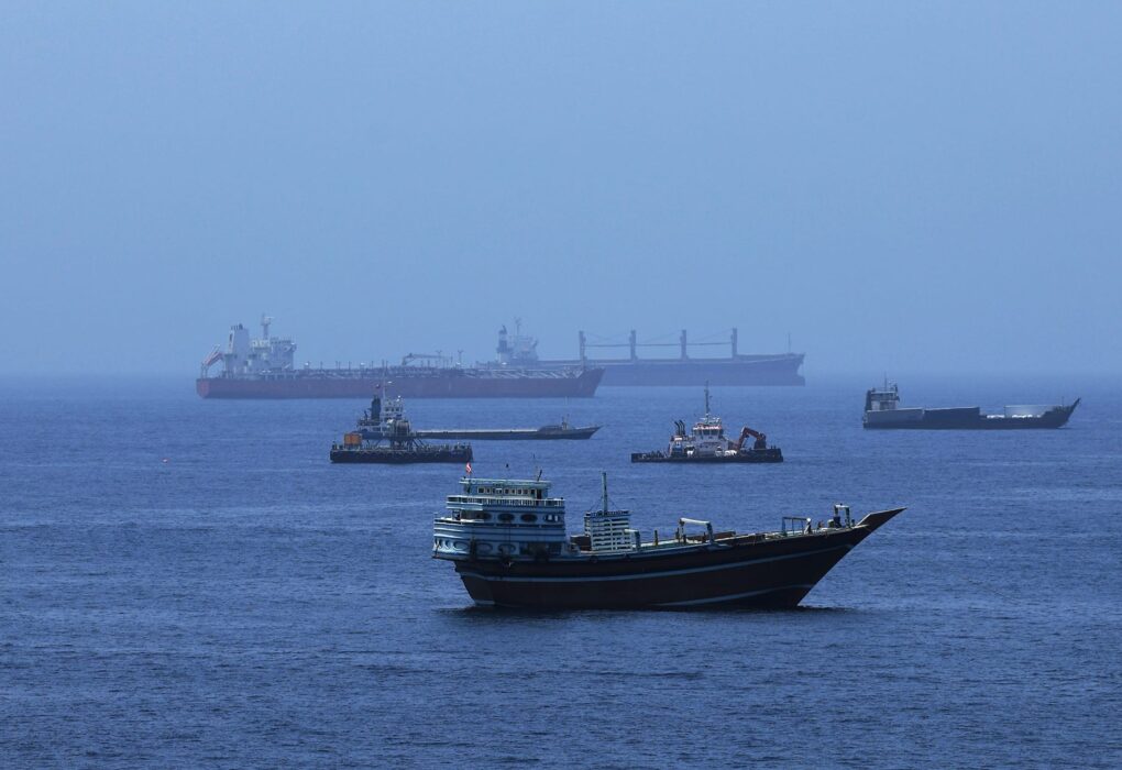 Oil tanker and boats in the strait of hormuz